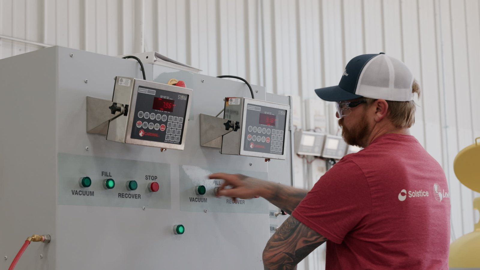 Lenz Distributing team member operating filling controls during operations filming