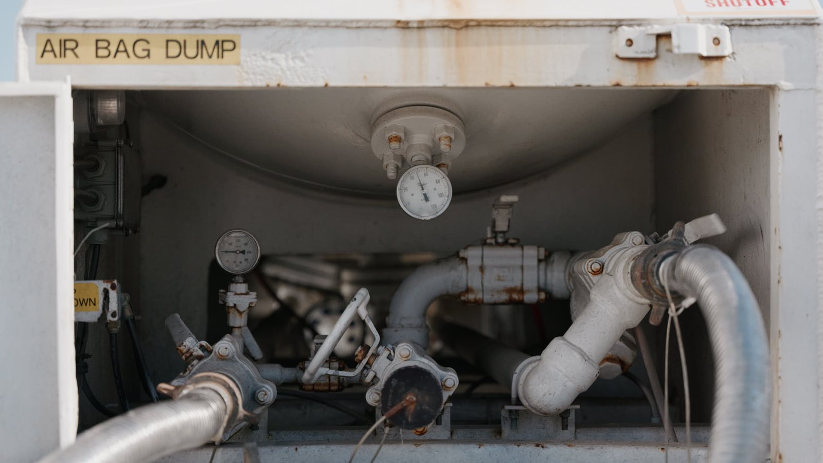 Industrial valve and gauge detail inside Lenz Distributing tank equipment