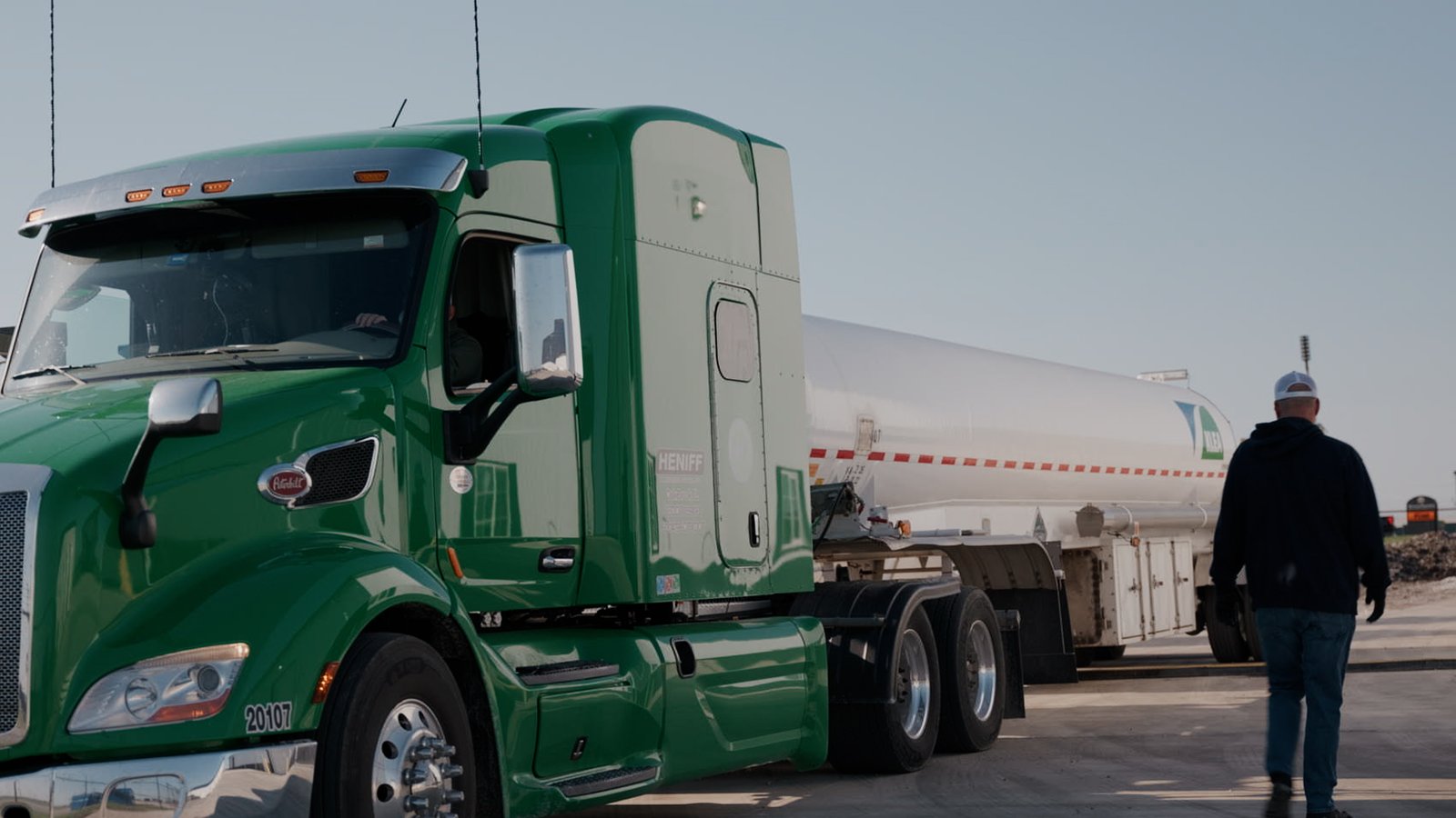 Lenz Distributing tanker truck beside storage tanks during an operations video shoot