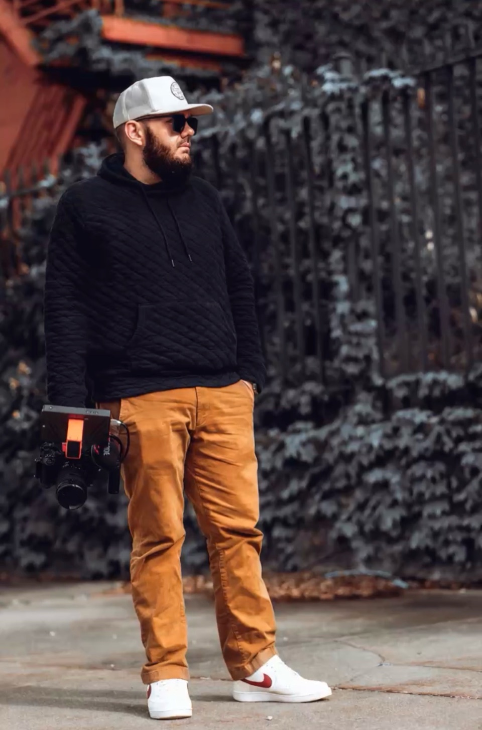 Phil Watson, founder and director of 55 North Creative House, holding a cinema camera on location.