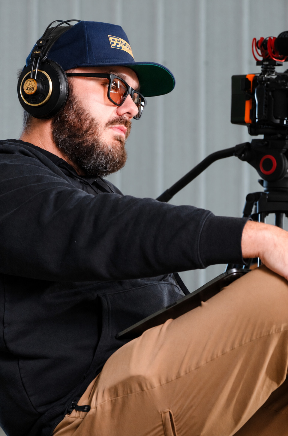 Phil Watson, founder and director of 55 North Creative House, monitoring a camera setup during a production shoot.
